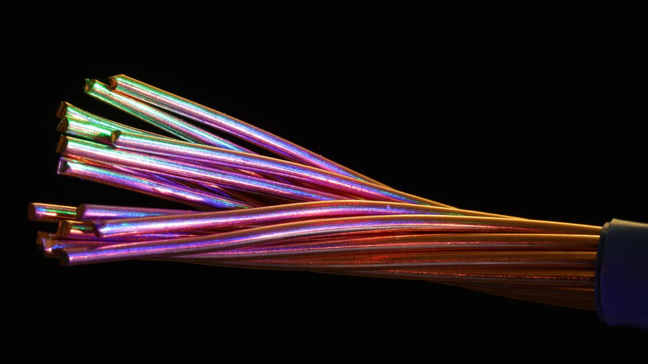The Art of Drawing Readers In: Your attractive post title goes here Vibrant multicolor fiber optic cables against a dark setting, showcasing technology and design.